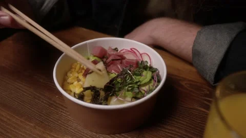 The man eats Poke Stock Footage 223884155