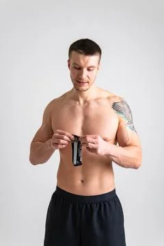 Man eats protein bar on white background isolated young diet healthy, eating Foto stock