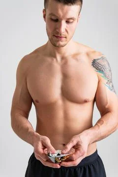 Man eats protein bar on white background isolated bar energy eating health white Stock Photos