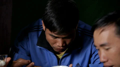 Man Eats Rice with Chopsticks Stock Footage 35524427