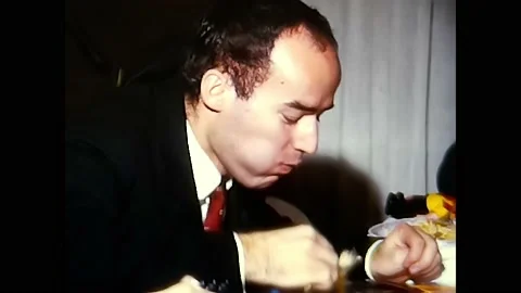 Man eats spaghetti at the table 60s Video stock 171881142