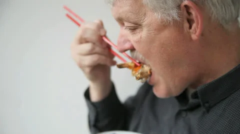 Man eats sushi Stock Footage 24693209