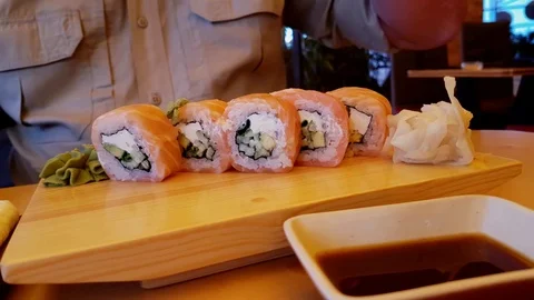 Man eats sushi Stock Footage 80467450