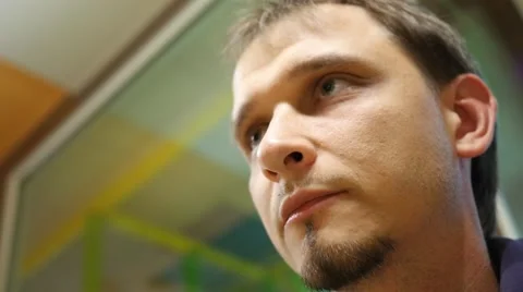 Man eats tasty chicken drumstick in fast food restaurant Stock Footage 51796659