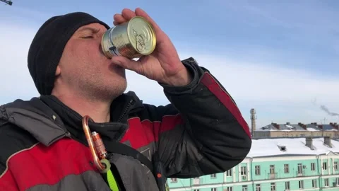 A man eats from a tin can. A man eats canned corn Stock Footage 235626848