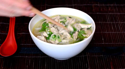 Man eats Vietnamese soup pho Stock Footage 37797223