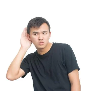Man eavesdropping. Young guy with hand on his ear listening Stock Photos