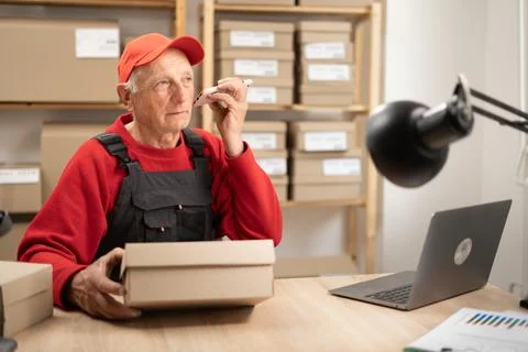 Man ecommerce business worker elderly male person listening voice message b.. Stock Photos