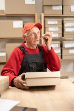 Man ecommerce business worker elderly male person listening voice message b.. Stock Photos