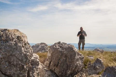 A man on the edge of a cliff Stock Photos