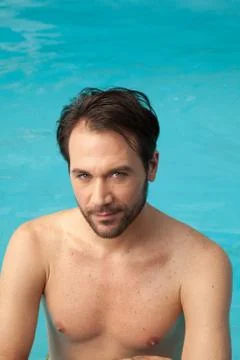 Man in the edge of the pool relaxed 写真素材