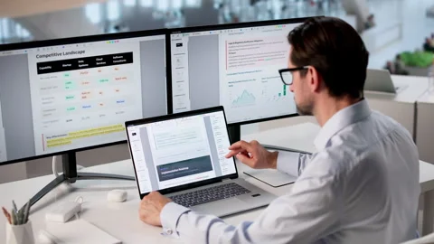 Man Editing Artificial Intelligence Implementation Plan Stock Footage 334537653