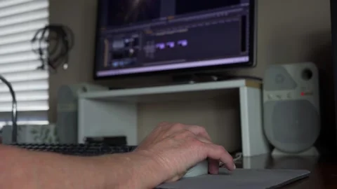 A man editing video on a computer Stock Footage 274208165