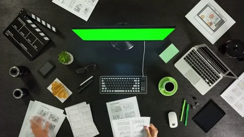 A man is editing video, using the editing program. Top view, working timelapse Video stock 77666554