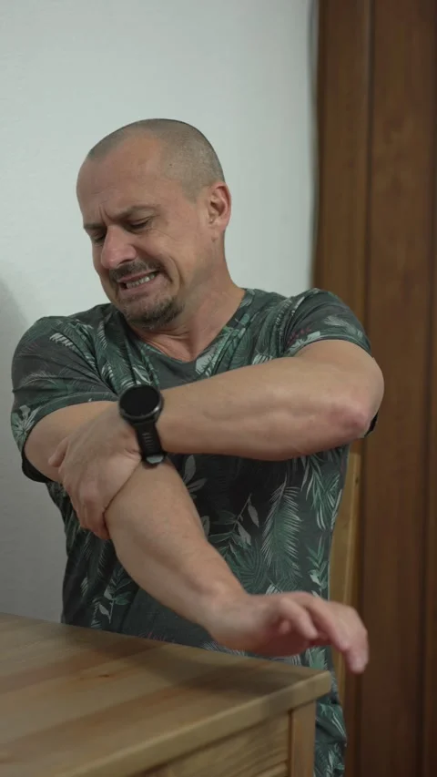 Man with elbow pain Stock Footage 296104084