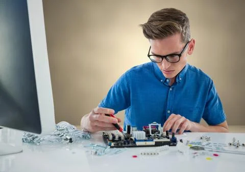 Man with electronics against bronze wall Stock Photos