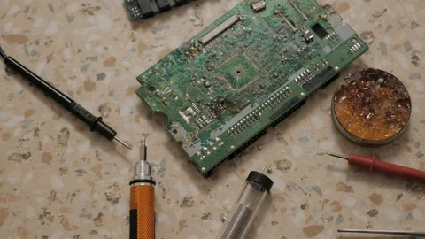 Man Electronics Engineer Is Soldering An Electric Board In His Workshop. Stock Footage 129077866