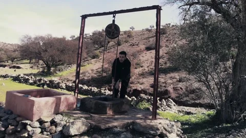 Man Embracing Freedom on Cloudy Mountain, Ait Issafen, Morocco Vídeo Stock 332770797