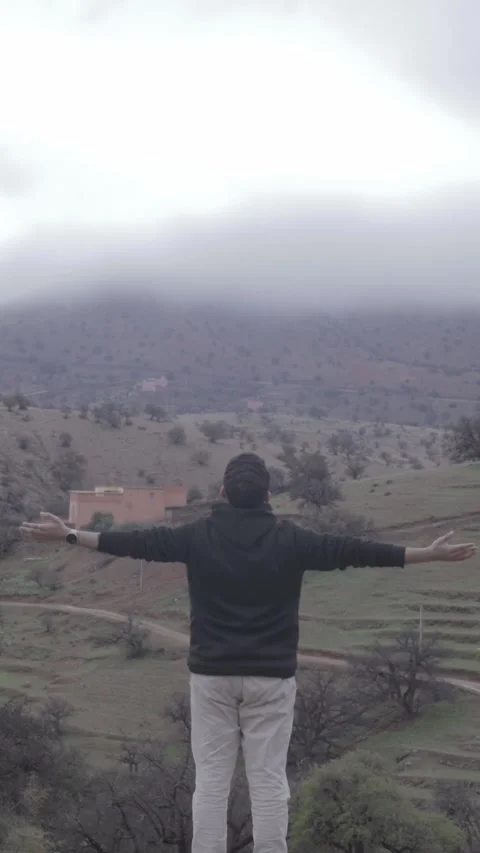 Man Embracing Misty Mountain View, Ait Issafen, Morocco Stock Footage 332772700