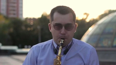 A man emotionally playing the saxophone Stock Footage 77735535