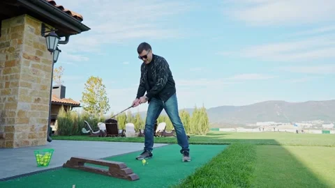 Man emotionally plays golf Video stock 164921800