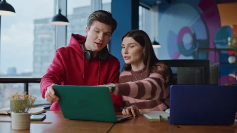 Man employee asking colleague to help with online program in coworking closeup. Stock Footage 340079176