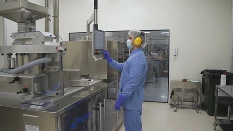 Man employee work with computer control production process in pharmaceutical Stock Footage 120419169