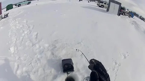 A Man Employing a Flasher While Catching Fish - High Angle Shot Stock Footage 267280378