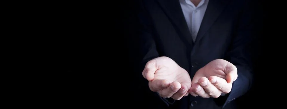 Man empty hands on darck background Stock Photos