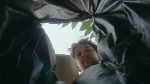 Man Emptying a Bag of Sorted Plastic into Trash Can Stock Footage 236982703