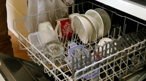 Man emptying dishwasher Stock Footage 49622034