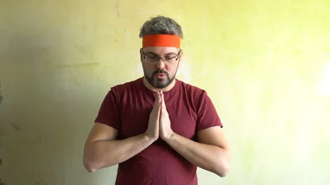 A man is engaged in breathing exercises 4K Stock Footage 126125824