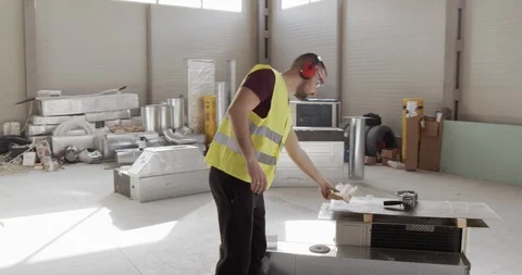 A man, engaged in construction, wants to take a break and take a nap. Stock Footage 127058171