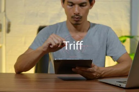 Man Engaged in Digital Interaction with Tablet on Wooden Desk Stock Photos