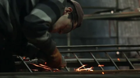 Man engaged in grinding metal Stock Footage 72070787