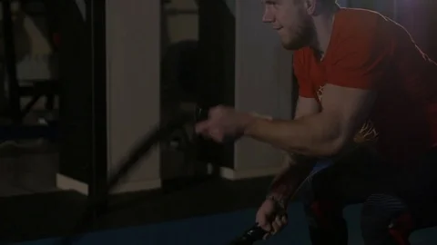 The man is engaged in the gym Видео 72097250