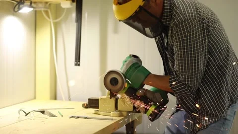 A man is engaged in locksmithing, works with metal Stock Footage 201042013