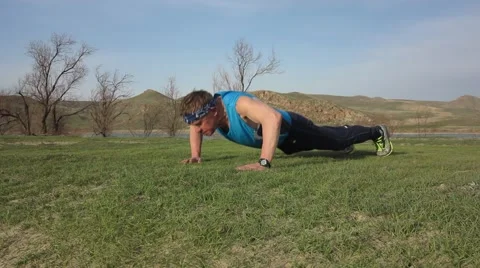 Man engaged in physical exercise in the nature Stock Footage 61643707