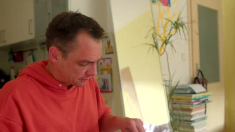 Man engaged in sorting bills and letters in quiet home study setting Stock Footage 320957318