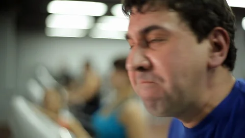 Man is engaged on the treadmill Stock Footage 100243399