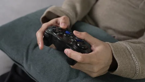 Man engaging and playing video game with concentrated expression Stock Footage 167940950