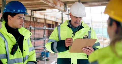 Man, engineer and clipboard with team for construction, inspection and report Stock Footage 337033206