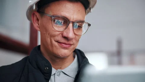Man, engineer and graphs with tablet for construction, budget and report for Stock Footage 341551288
