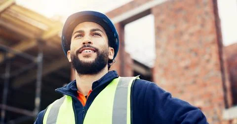 Man, engineer and happy with thinking in city, helmet and urban development.. Stock Photos