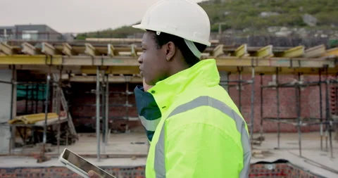 Man, engineer and phone call on construction site with tablet, compliance update Stock Footage 337627549
