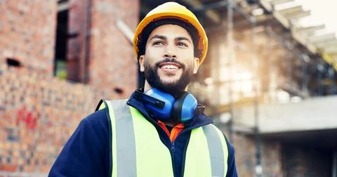 Man, engineer and smile with thinking in city, helmet and urban development.. Stock Photos