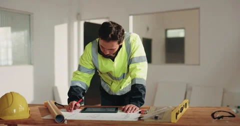 Man, engineer and tablet with blueprint for construction, research and sketch Stock Footage 341563996