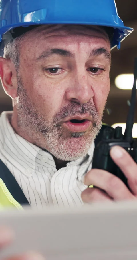 Man, engineer and tablet in factory with radio, planning or update in work Stock Footage 340604138