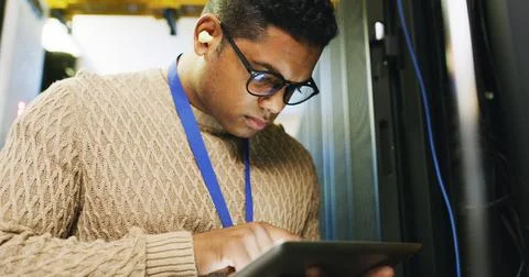 Man, engineer and tablet in server room for software, update system and 스톡 사진