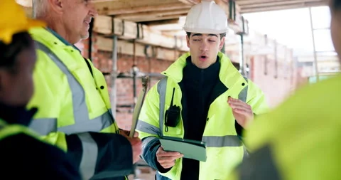 Man, engineer and tablet with team for construction, inspection and planning for Stock Footage 337015929